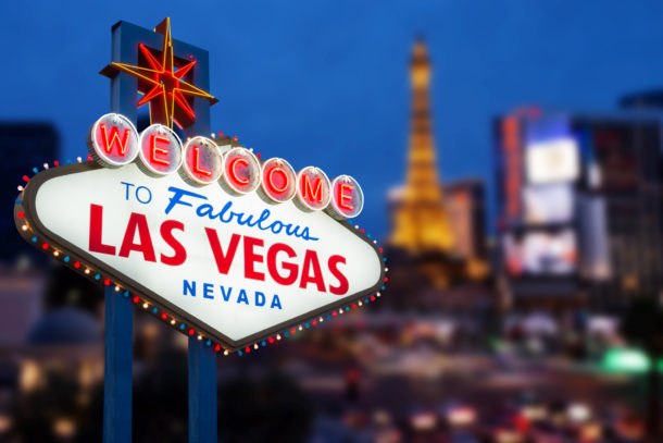 Welcome to fabulous Las Vegas neon sign with Las Vegas strip road background View of the strip on May 12, 2015